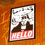 goatse obey sticker in a bar
