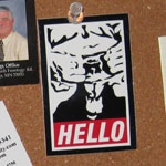 goatse obey sticker on a bulletin board